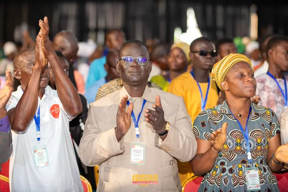 Delegates applauding during a session
